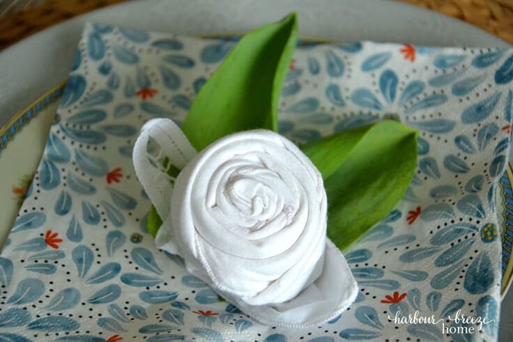 Spring tablescape with flower folded napkin from Kenarry Ideas for the Home and Rita Joy from Harbour Breeze Home